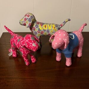3 Victoria's Secret PINK stuffed dogs, often considered collectibles.